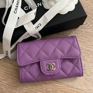 Chanel Flap Card Holder in purple.